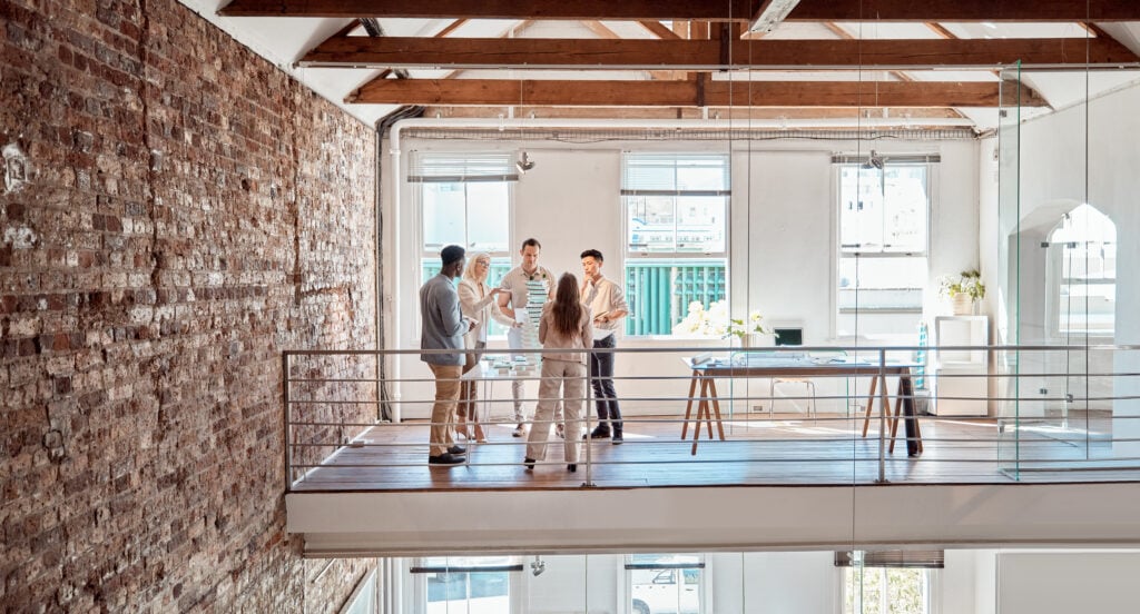 group-of-diverse-architects-discussing-plans-blue-2025-04-06-08-35-35-utc Mezzanine Flooring in the UK by Spartan Direct