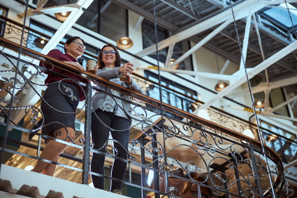 Two people having a chat on their newly installed mezzanine floor.
